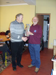Dave Mac receives a bottle on behalf of son John