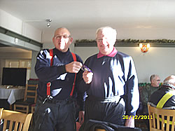 Frank Parker receives a packet of chocolate buttons from the organiser, Bob Taylor, for the scruffiest bike.