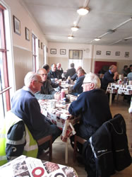 Riders eagerly await breakfast.