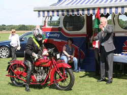 Brian Glover on his beautifully prepared Indian is flagged off by the Lord Mayor.