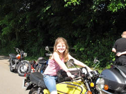 Organisers John and Ann Heywood’s granddaughter sitting on Maurice Taylor’s Honda